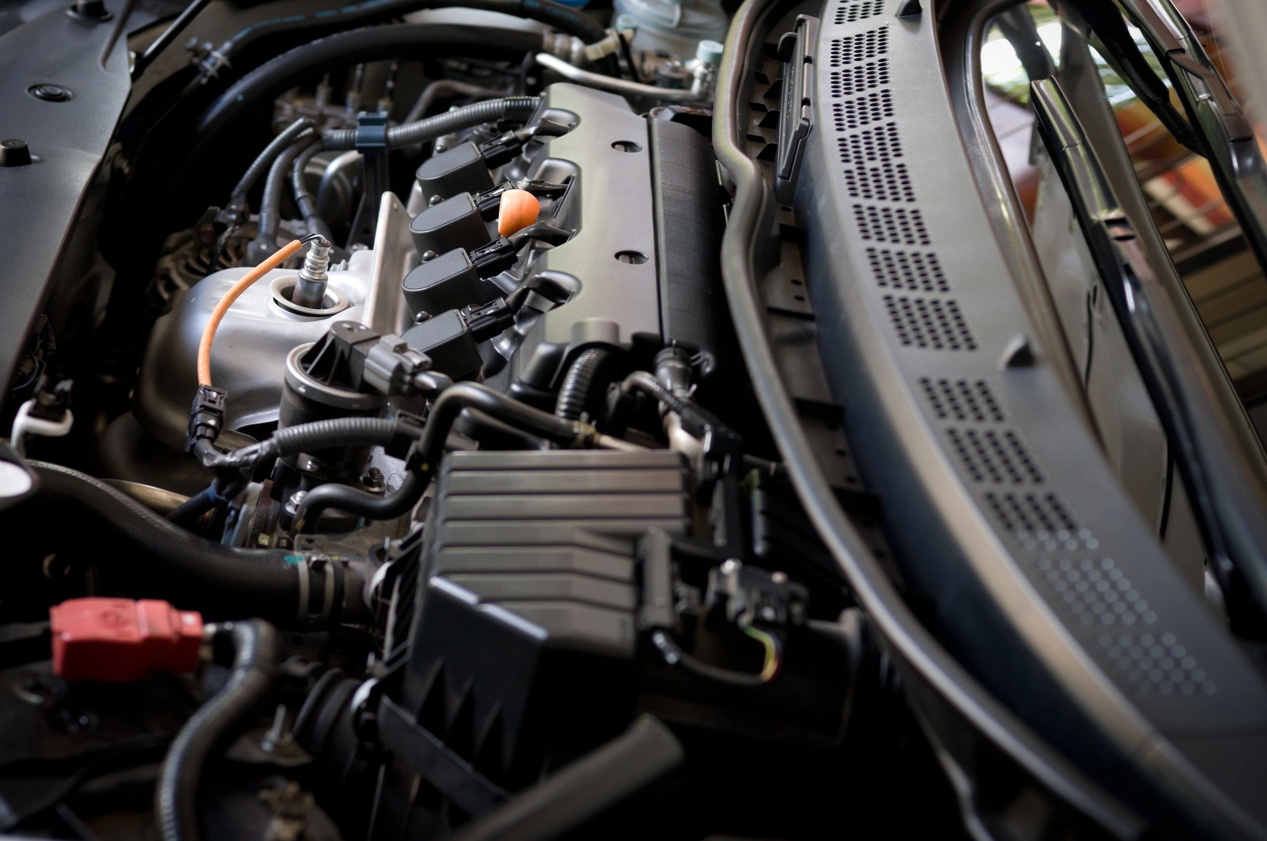 Close-up of a modern car engine in a clean workshop