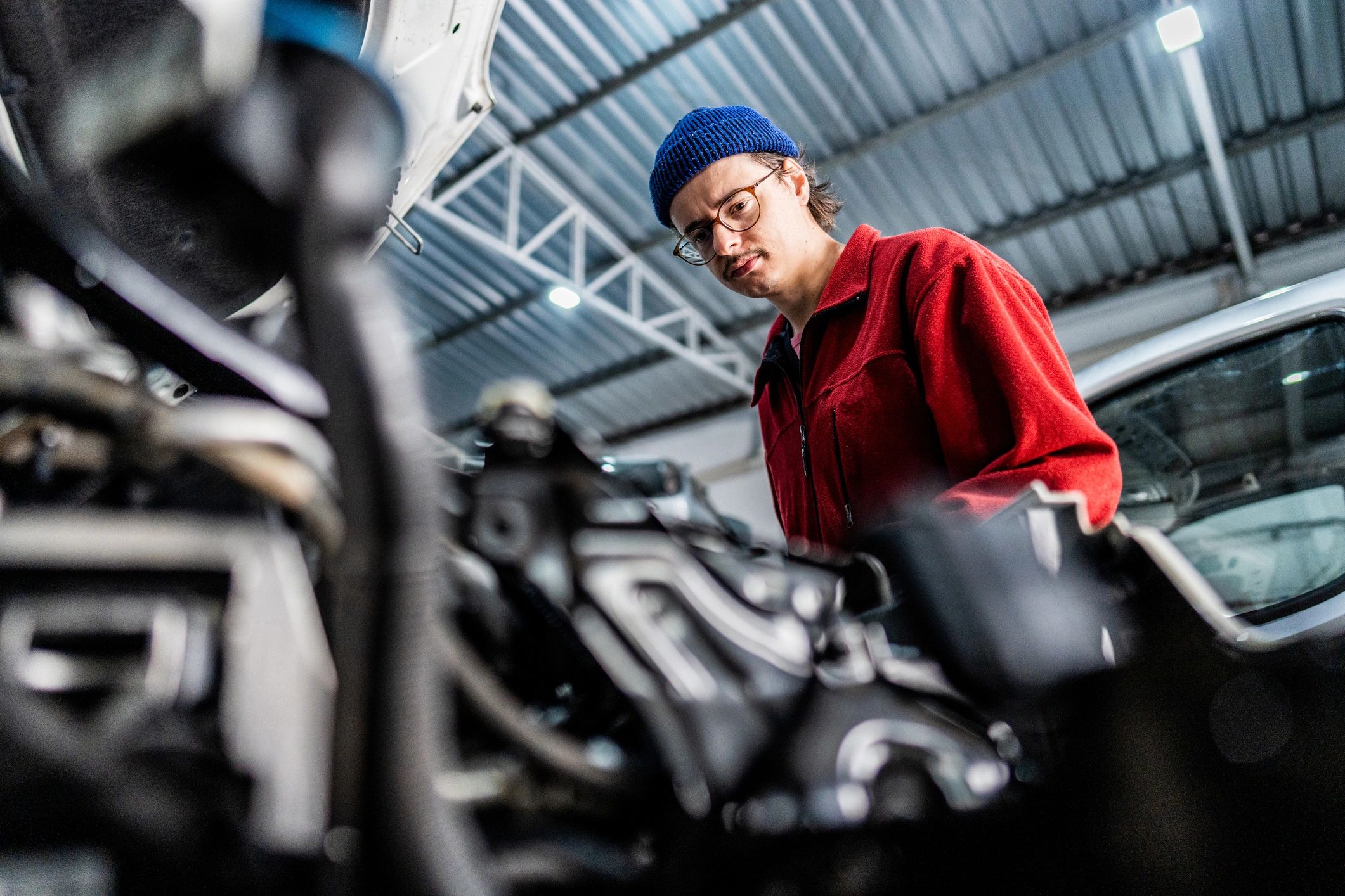 Mechanic working on a vehicle in an auto repair shop