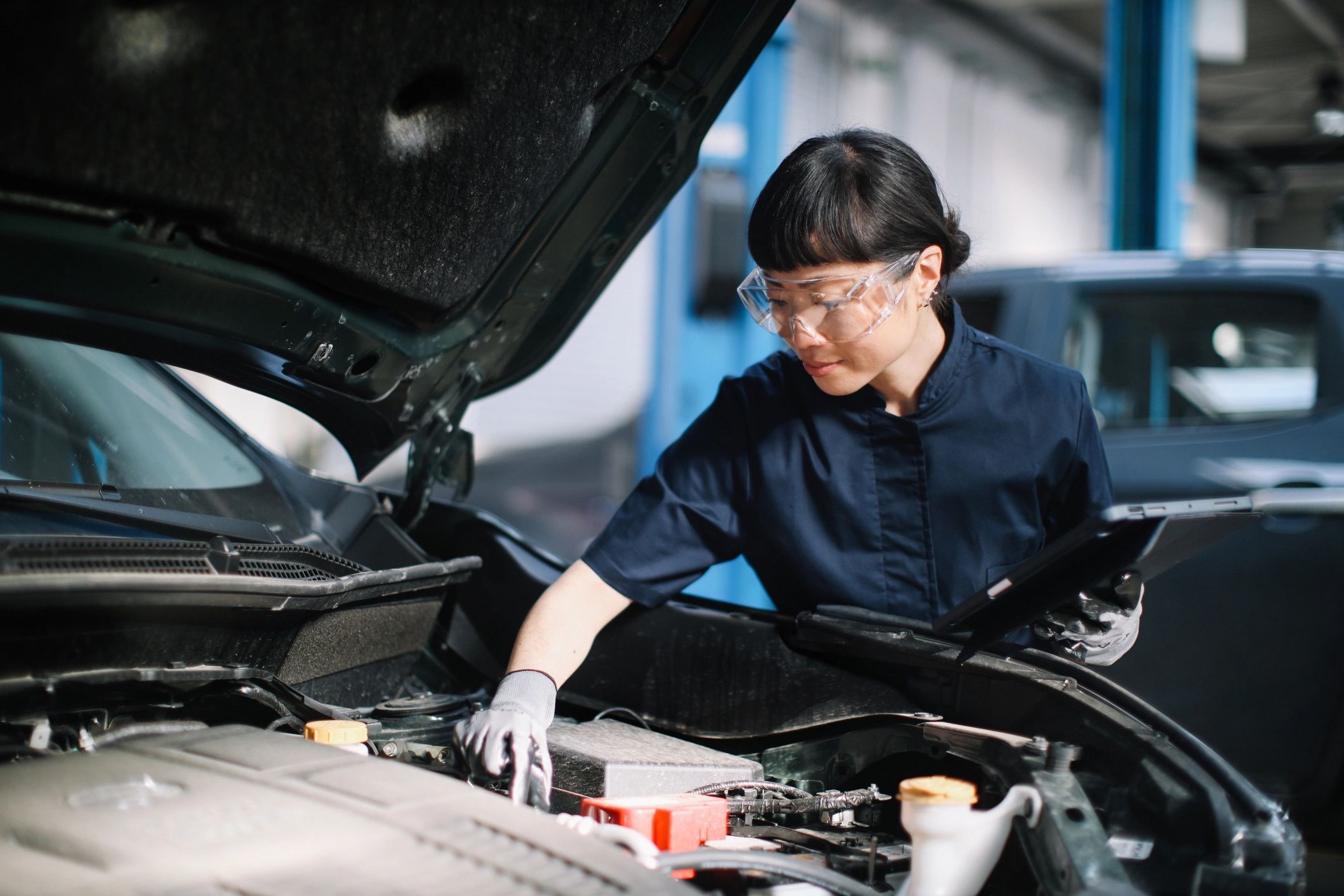 Mechanic inspecting a vehicle during routine maintenance