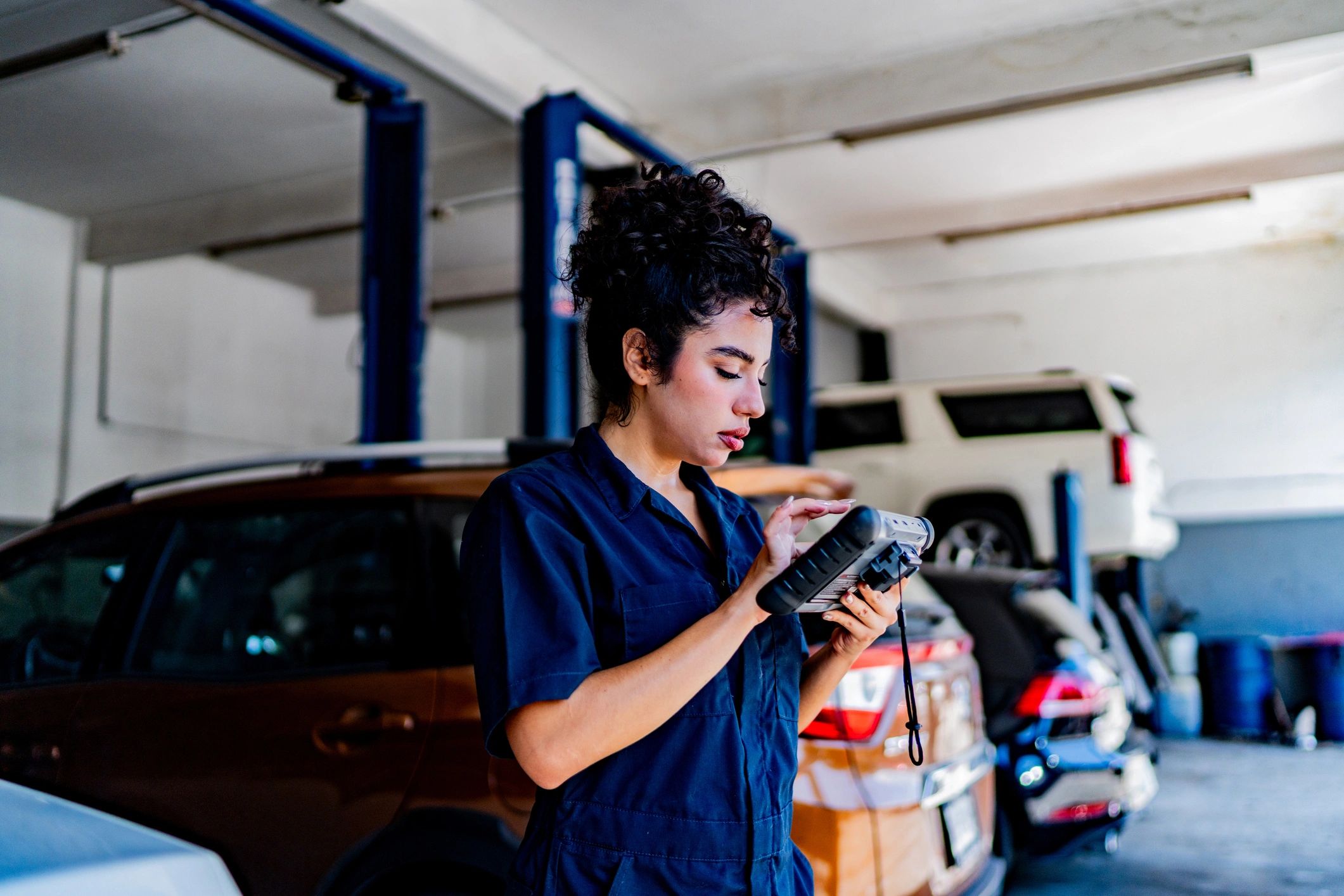 Mechanic performing a diagnostic scan in the shop