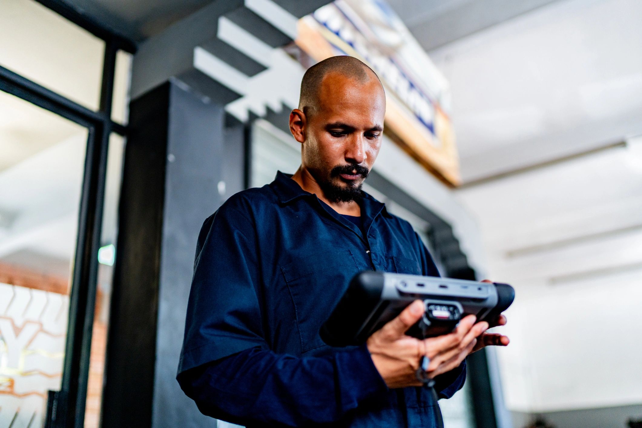 Mechanic using a scan tool for vehicle diagnostics