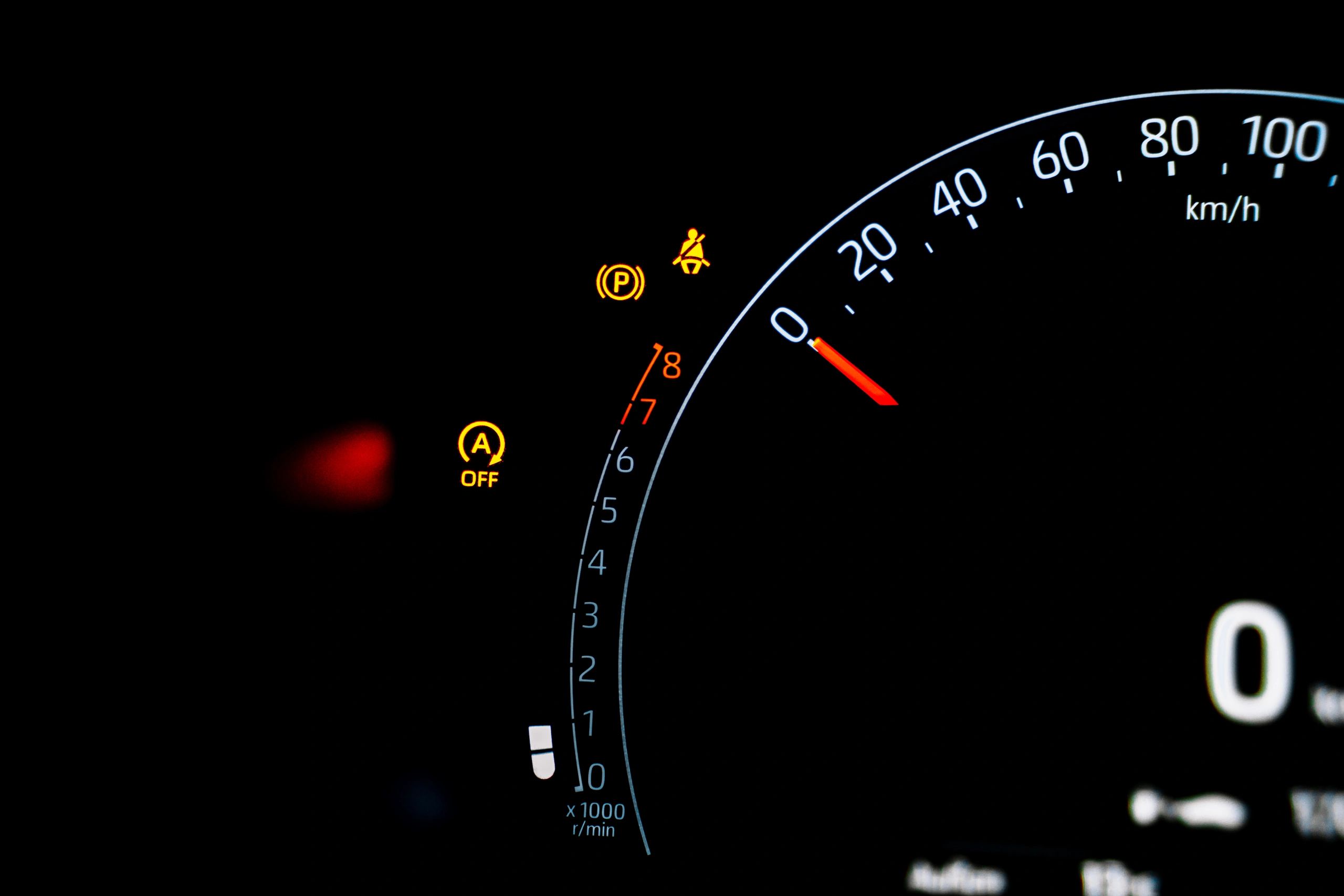 Car dashboard warning lights illuminated