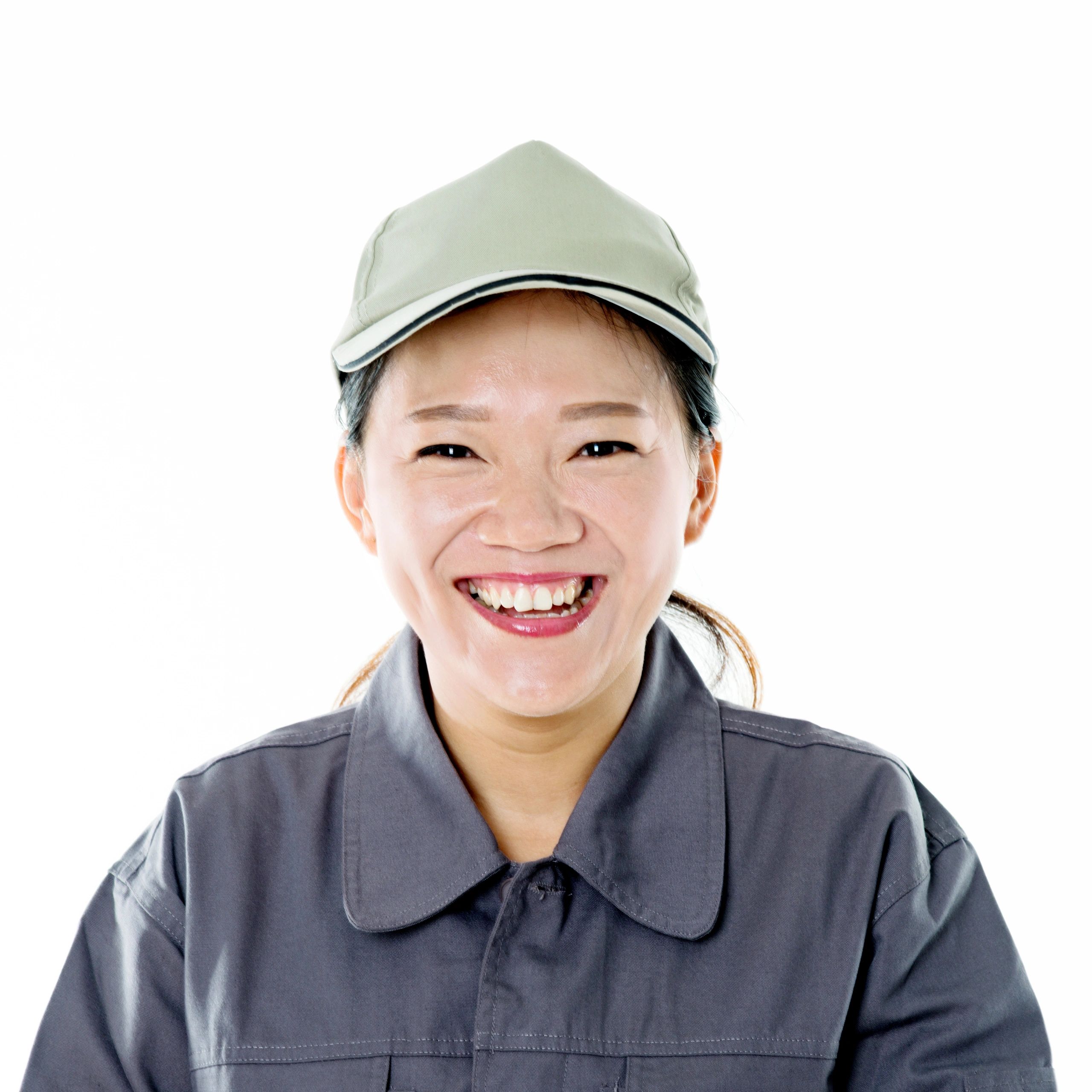 Smiling technician in a gray uniform