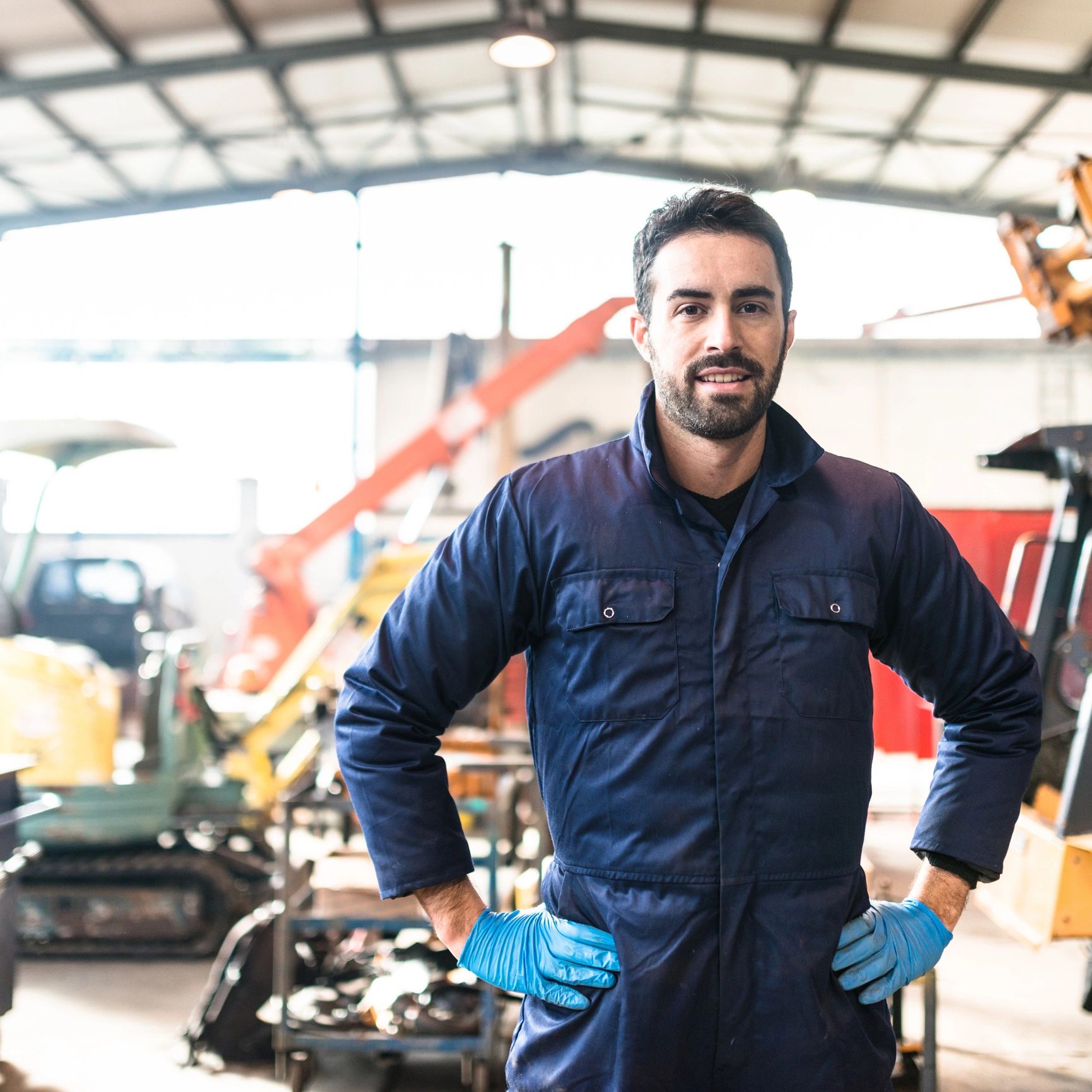 Customer portrait smiling in a garage