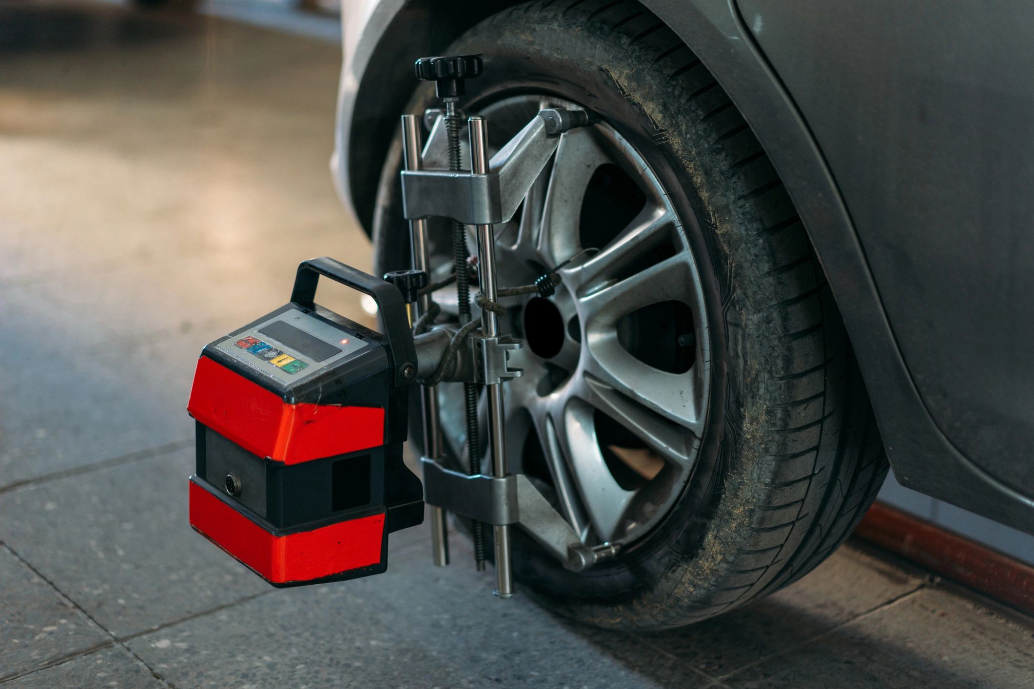 Close-up of a wheel and brake service equipment in a workshop